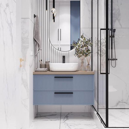 A Modern Floating Bathroom Vanity with Ribbed Blue Cabinetry, Neutral Countertop, and Elegant Vessel Sink Design